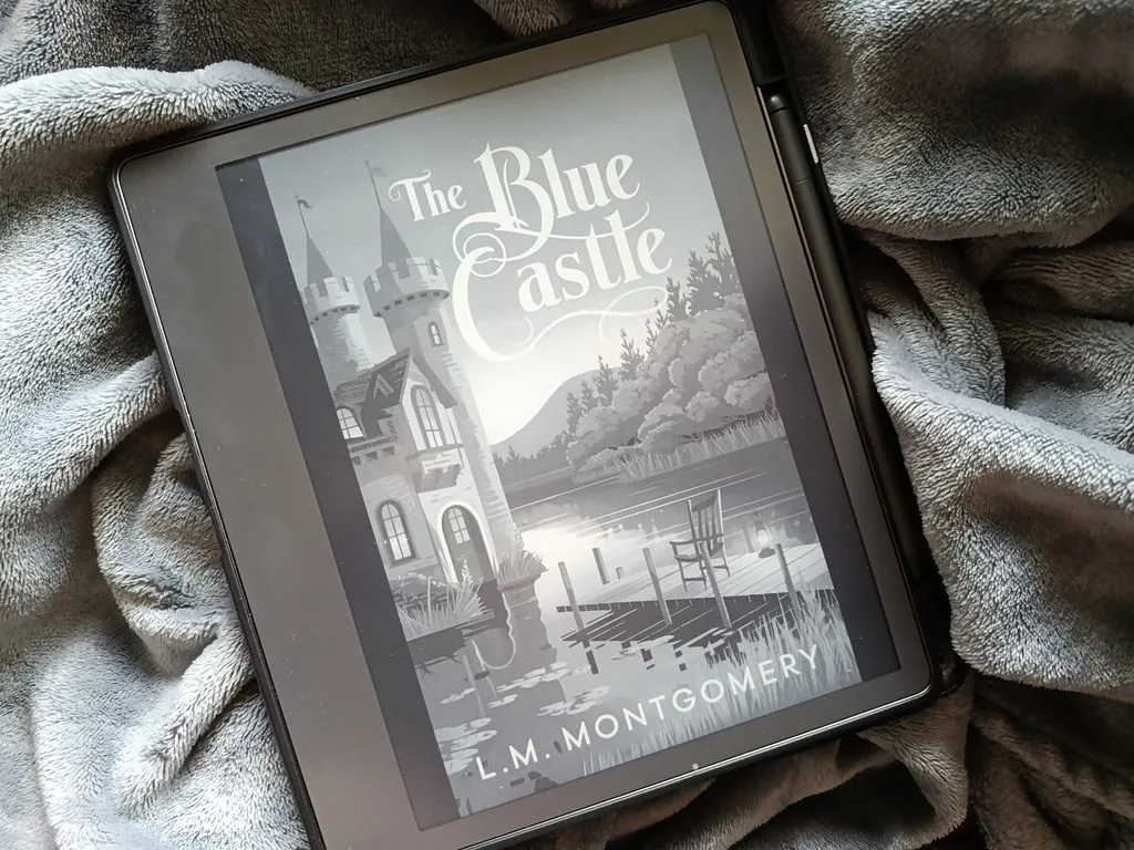 A photo of the Blue Castle by L. M. Montgomery open on Kindle Scribe so you can see the cover