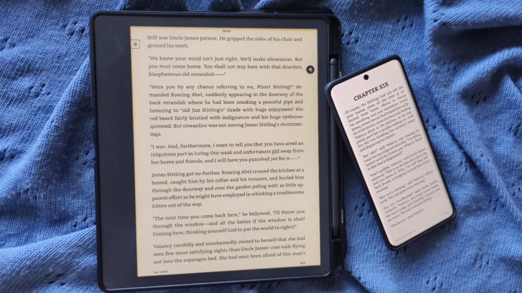 A photo of a Kindle Scribe next to a  phone with a book open, to illustrate the point that the screen is very different