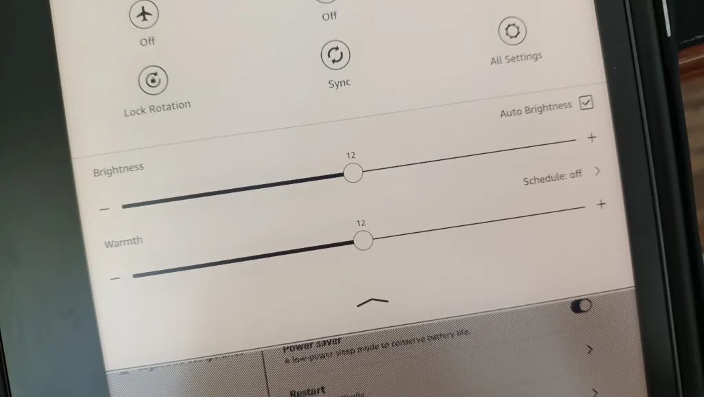 A photo showing light warmth and brightness adjustments on a Kindle Scribe