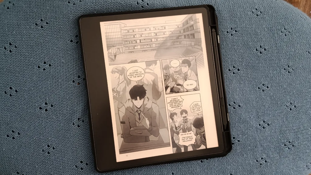 A photo of a Kindle Scribe with a manga open on it to showcase how screen size is important for manga readers
