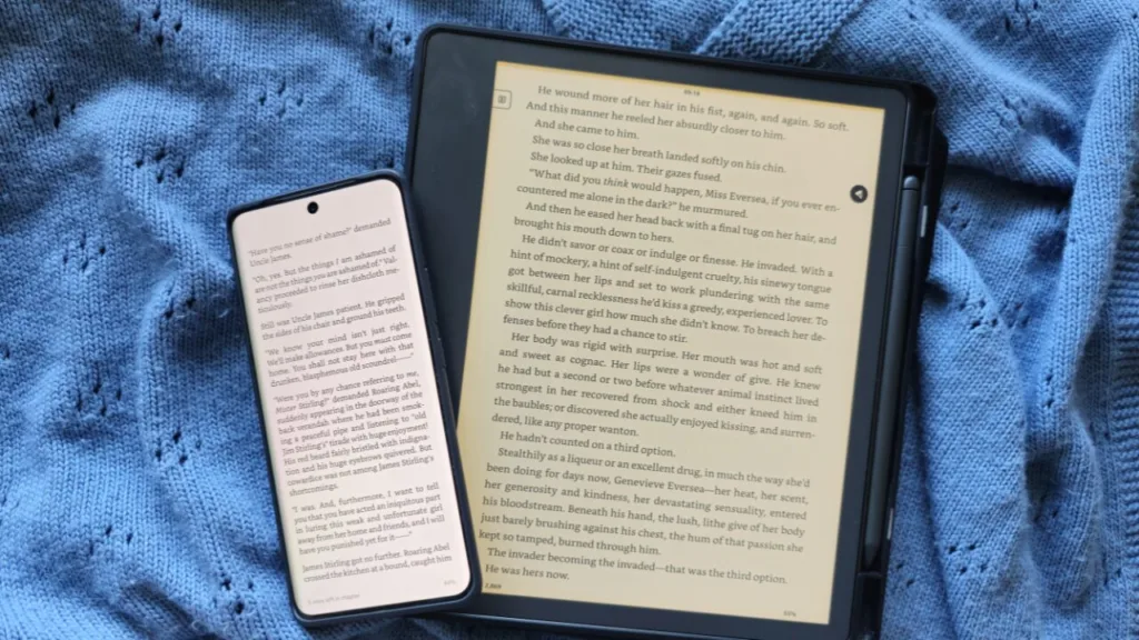 A photo of a Kindle Scribe next to a phone to illustrate the point that you may not need a Kindle if you already read on your phone and your budget is tighter