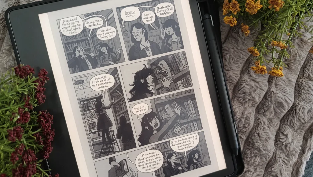 A photo of a comic book/graphic novel (mooncakes) open on Kindle Scribe in vertical, one column mode