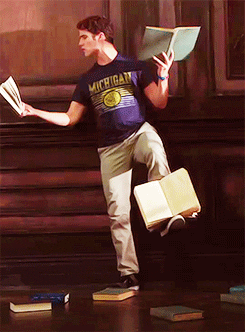 A meme of a guy balancing many books at once